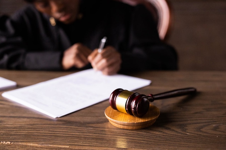 Judge Signing on the Papers