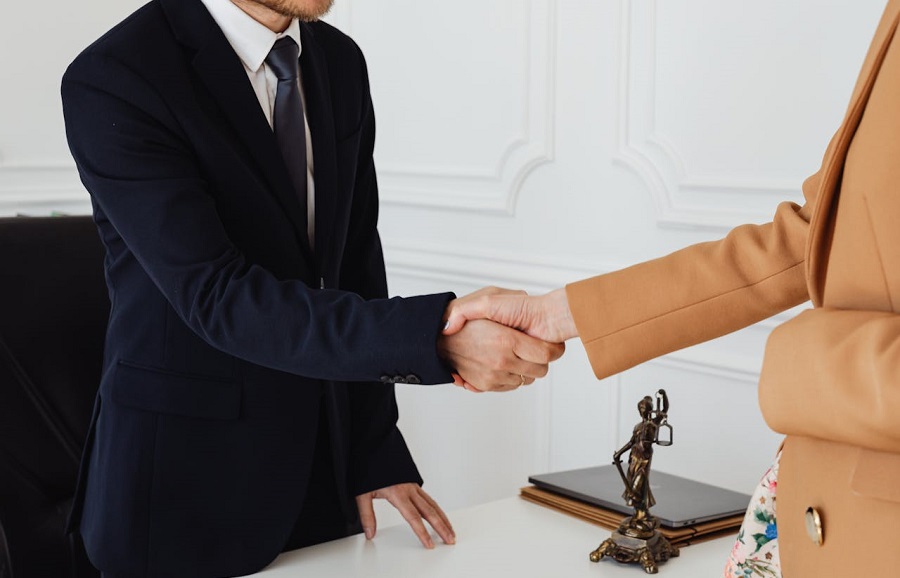 People in Corporate Attire Shaking Hands