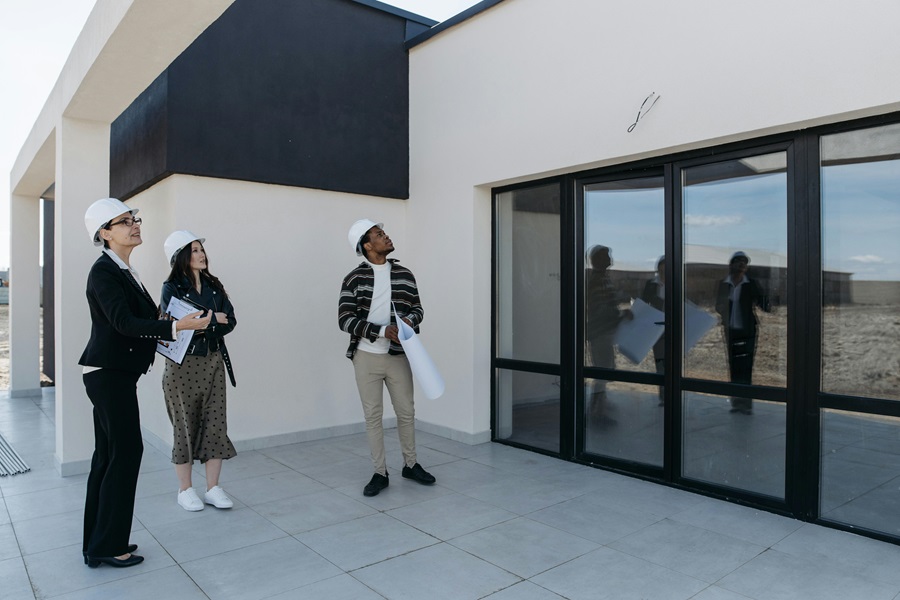Engineers inspecting completed building before handover