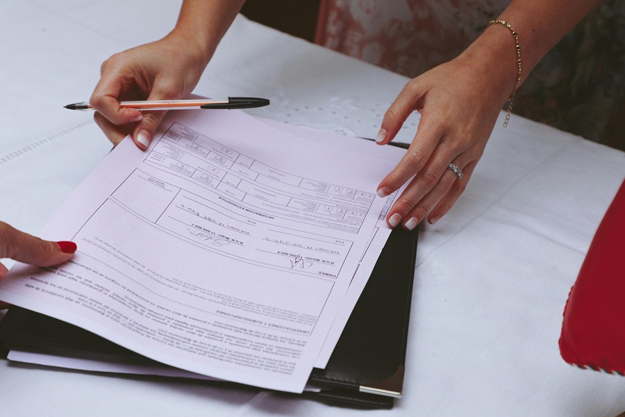 Signing probate application form and reviewing legal documents