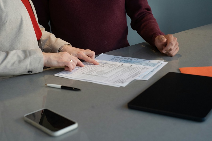 two entrepreneurs signing a contract
