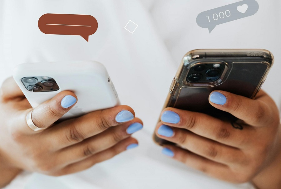  hands holding two phones, person victim of malicious communication