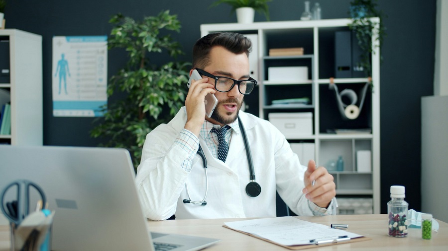 
A doctor on the phone, working on a sepsis negligence case.