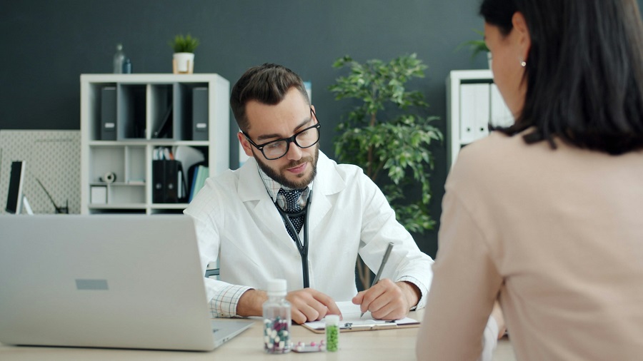Patient in medical consultation with doctor